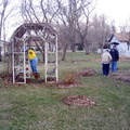 Joyce and her parents working on the yard