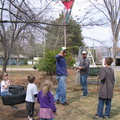 John and Lydia brought a pinata for the kids to hit! John and Melvin are setting it up as some of the kids look on.
