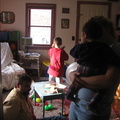 Brad on floor, Kate holding Issac, and Alex with ever present remote